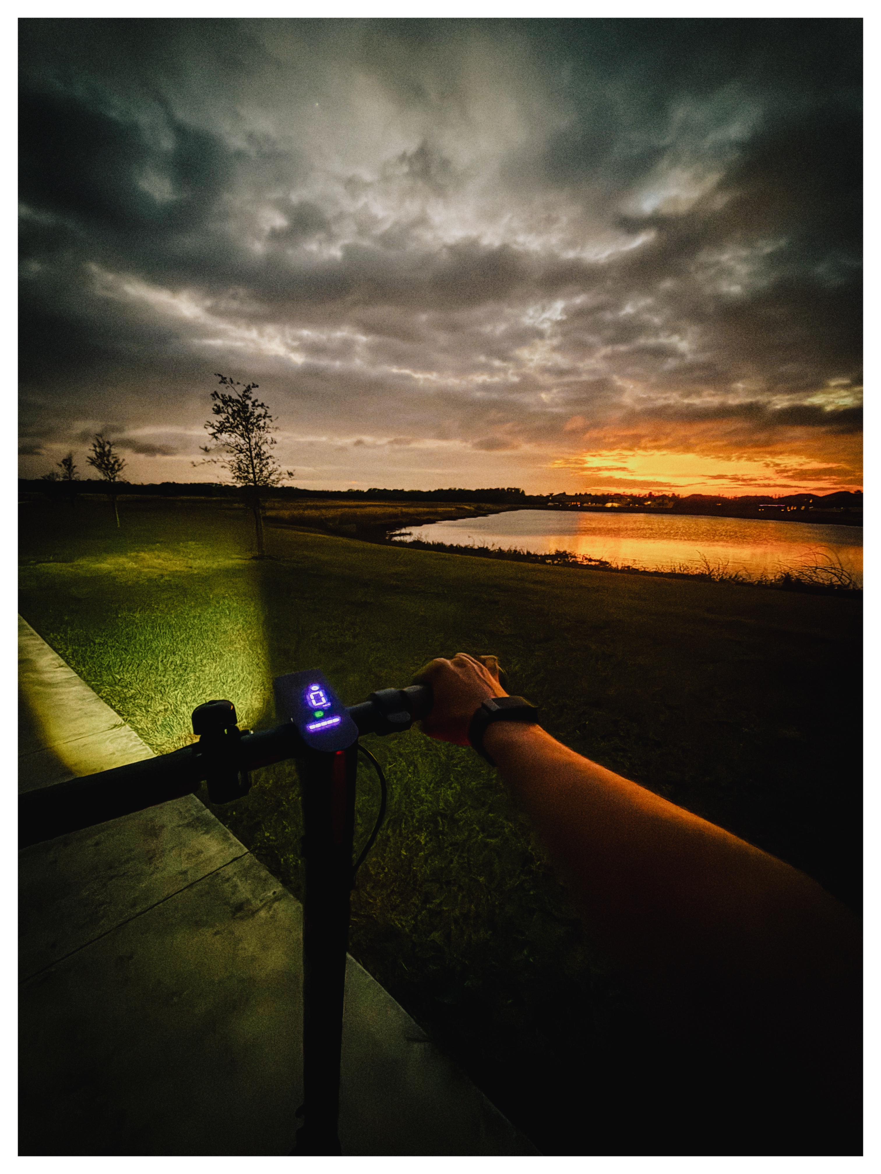Riding at sunset beside a retention pond